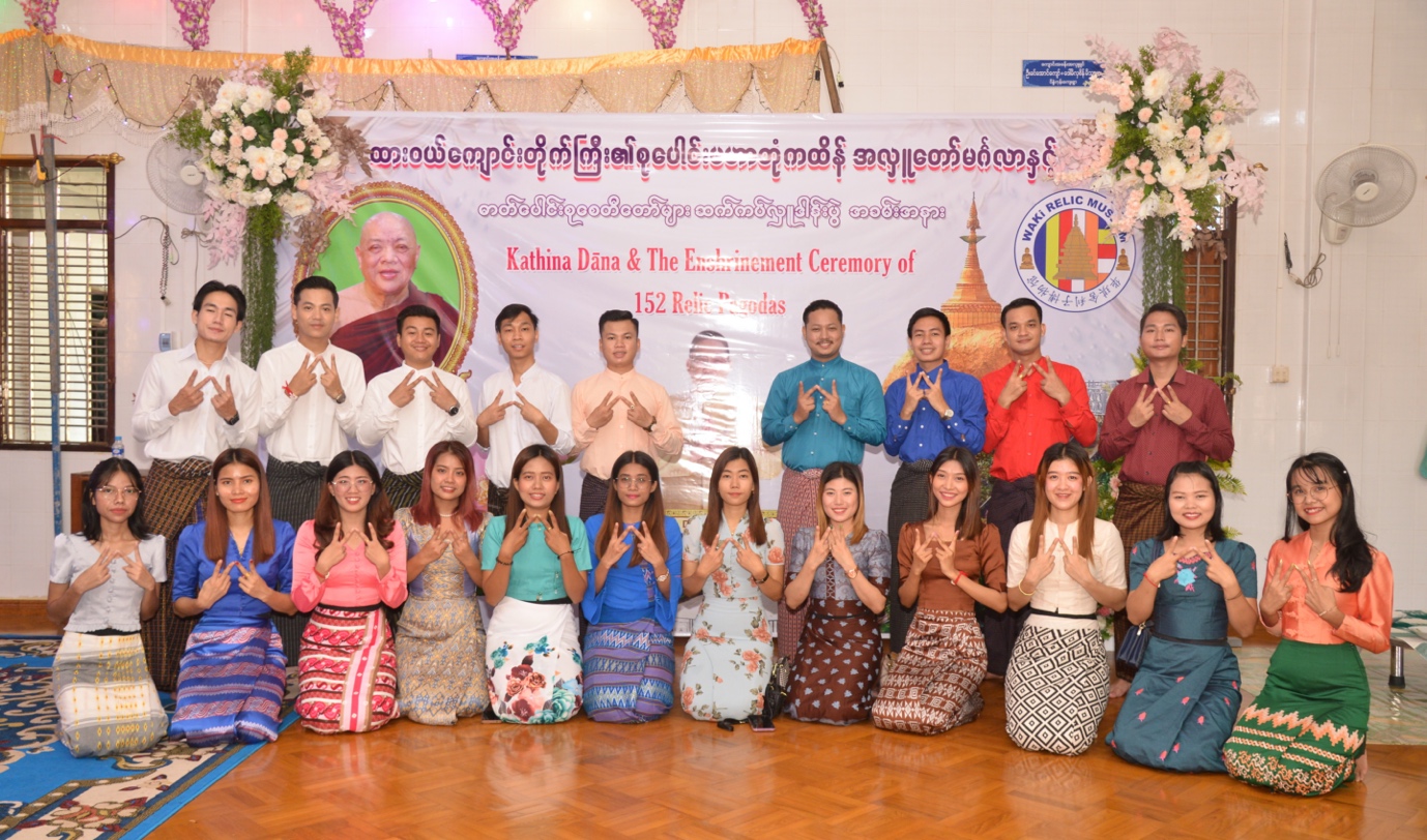 A group of people posing for a photo
Description automatically generated